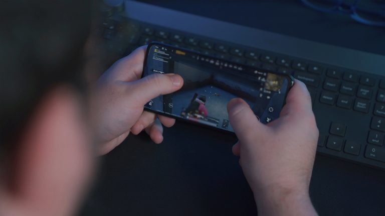 Person playing a mobile game