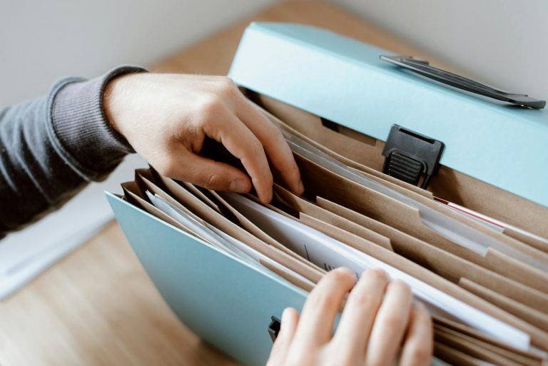 Stock image of a person looking through files