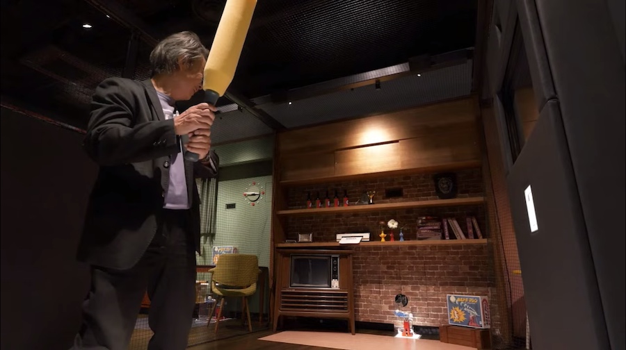 Shigeru Miyamoto tries Nintendo Museum baseball batting game