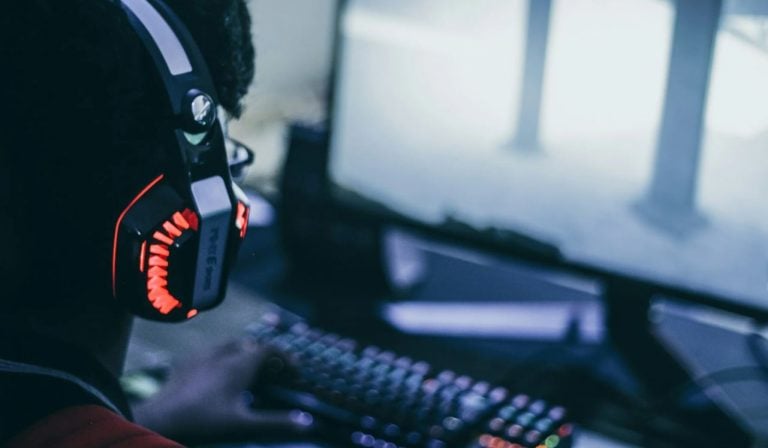 Stock image of a person in front of a PC screen