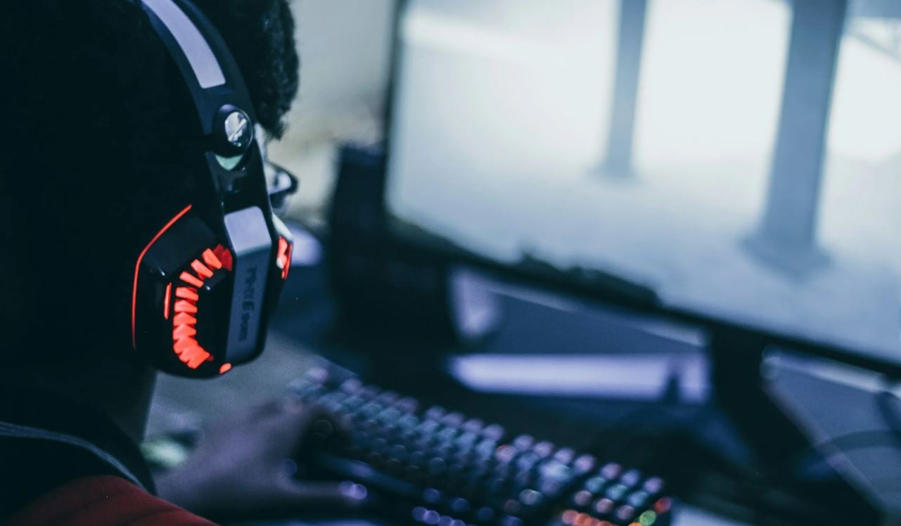 Stock image of a person in front of a PC screen