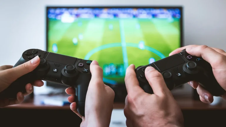 Stock image of two people holding controllers