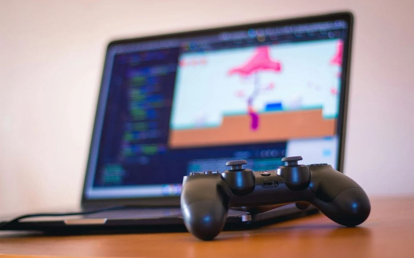 Stock image of controller and laptop